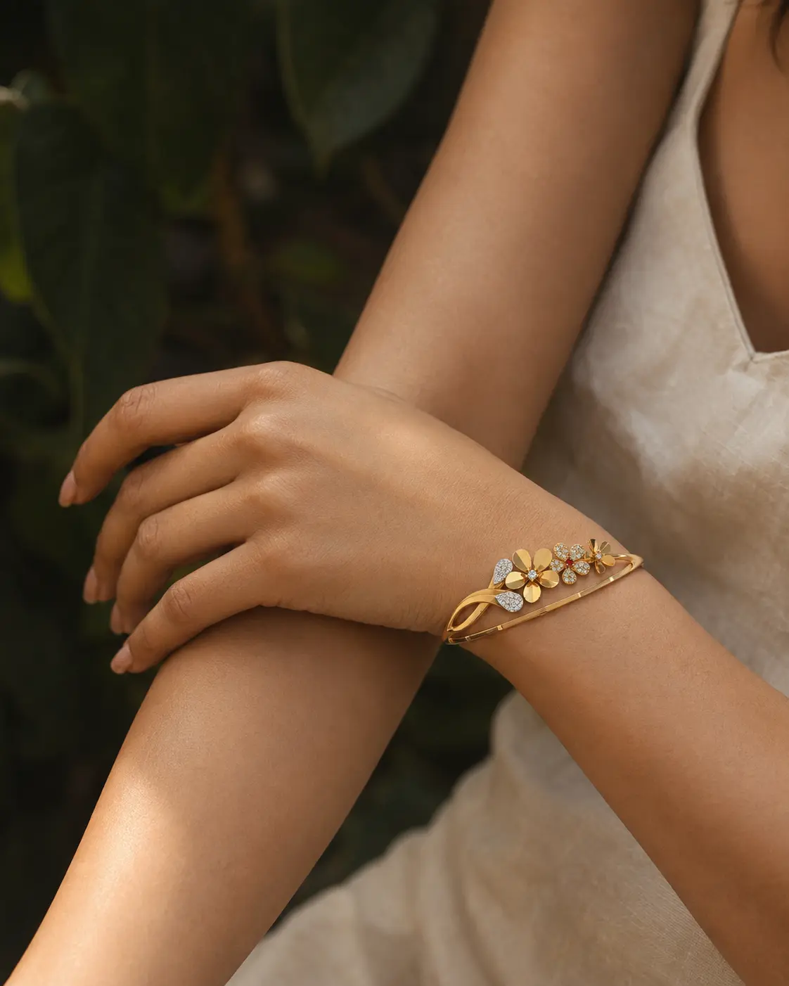 Floral gold bracelet styled in natural light