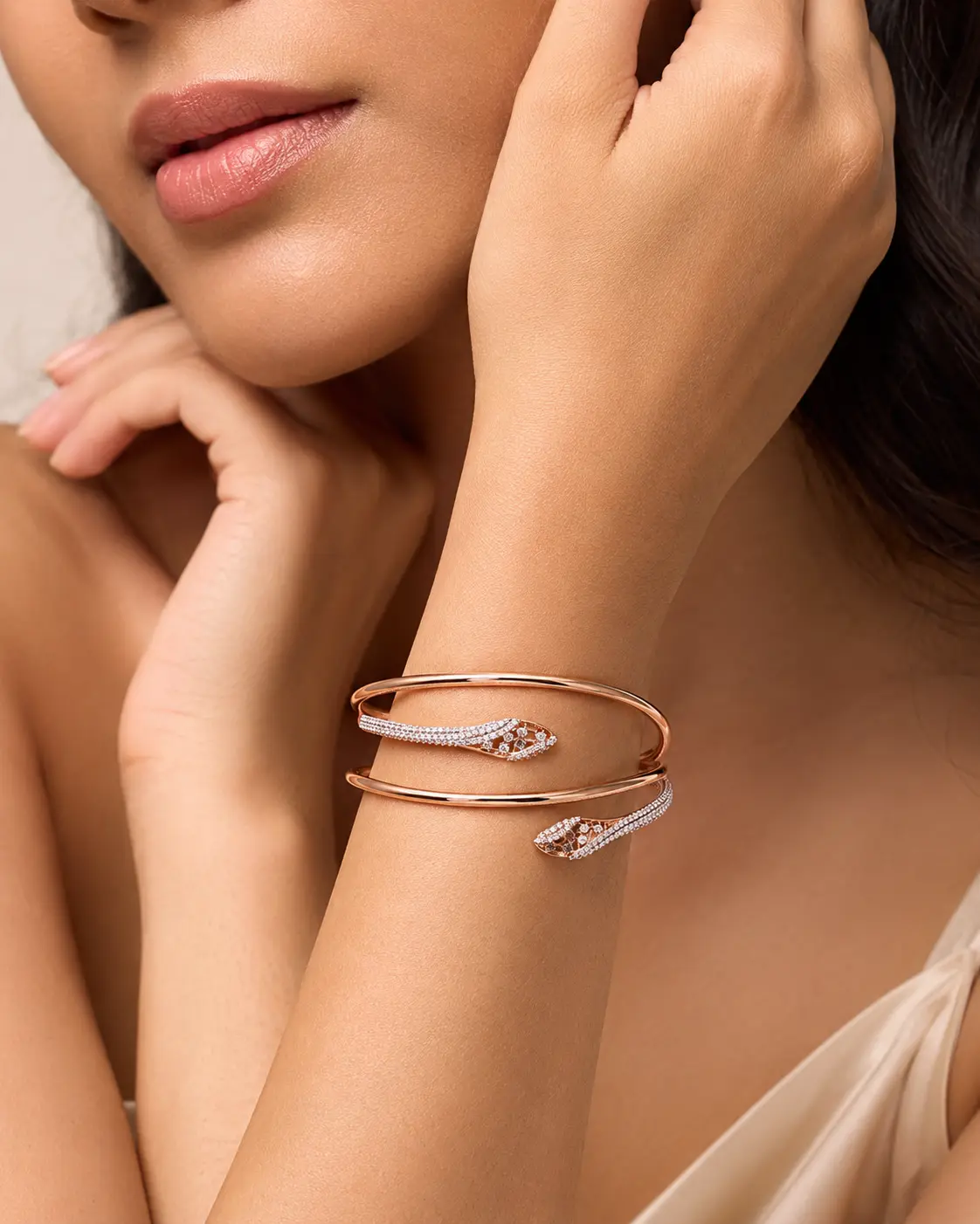 Model wearing a rose gold serpent bracelet